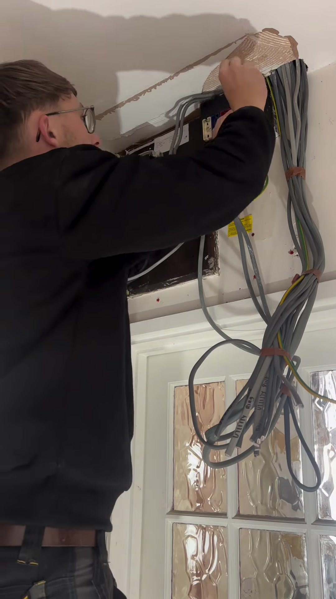 Cables run through a ceiling during a rewire by RM Electrical